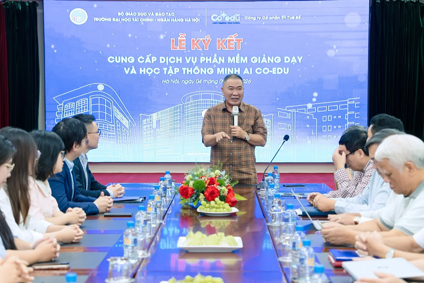 A university representative speaks at the meeting with Co-EDU